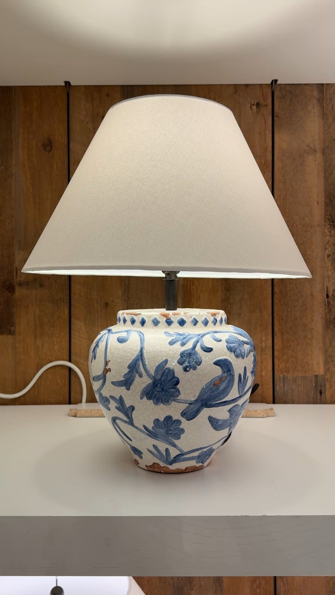 A charming touch for any room! 🤍 The Montrose Ceramic Table Lamp from Pottery Barn is a standout decorative accent with its white base and delicate blue birds and vine floral motif. 😍 Crafted from terracotta clay and available in short and tall sizes, it brings classic elegance and a pop of pattern to a nightstand, console, or side table. Linked this lamp along with more beautiful blue, designer-inspired table lamps to shop! 💙 #PotteryBarn #TableLamp #DecorativeAccent