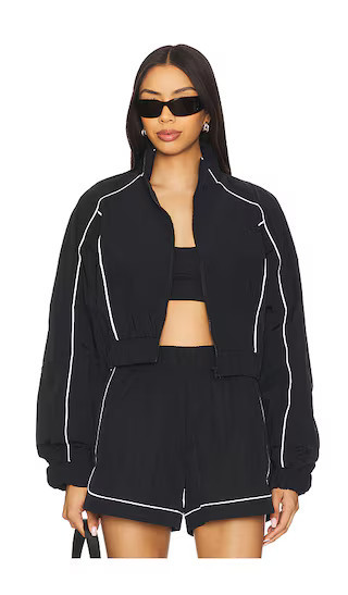 alo Motivate Full Zip Track Jacket in Black & White. - size S | Revolve Clothing (Global)