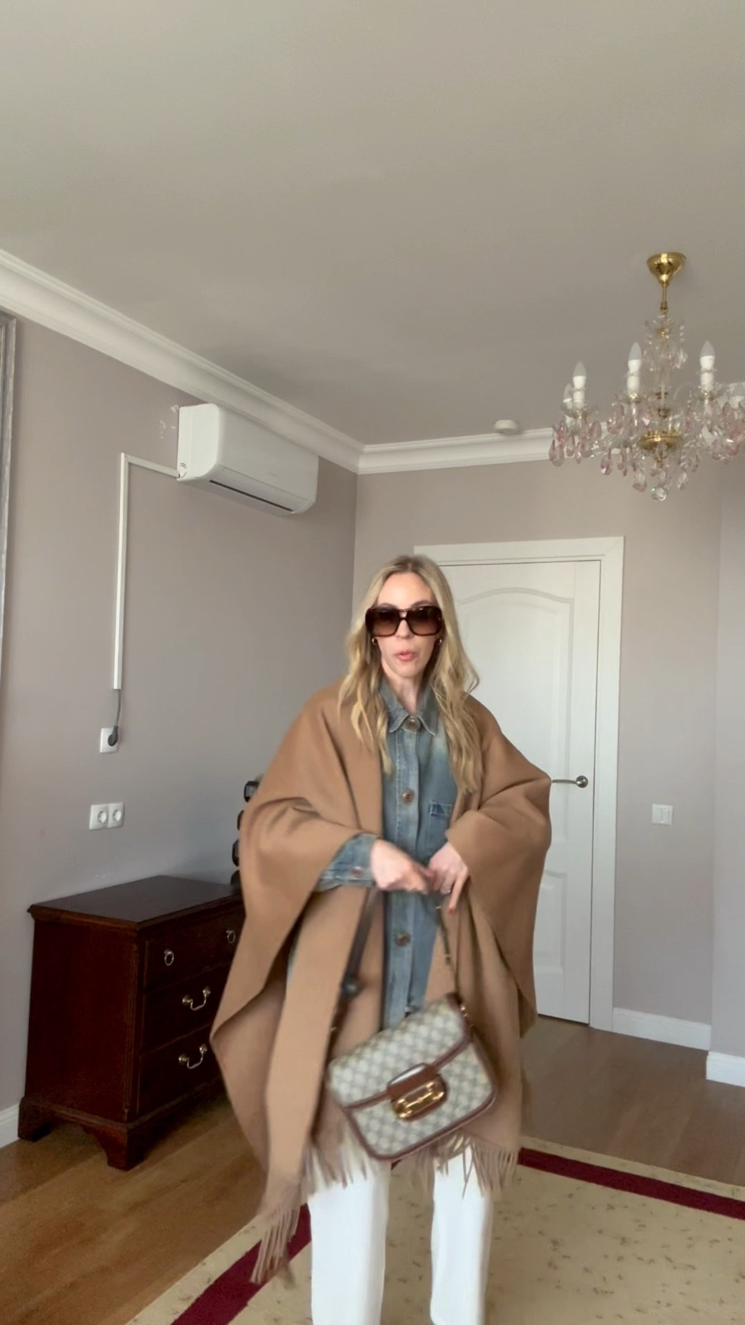 Look of the day, camel wrap, poncho, oversized denim shirt, denim on denim, @levi white baggy 90’s jeans, cowboy boots 

#LTKdayinmylife #LTKgrwm #LTKootd