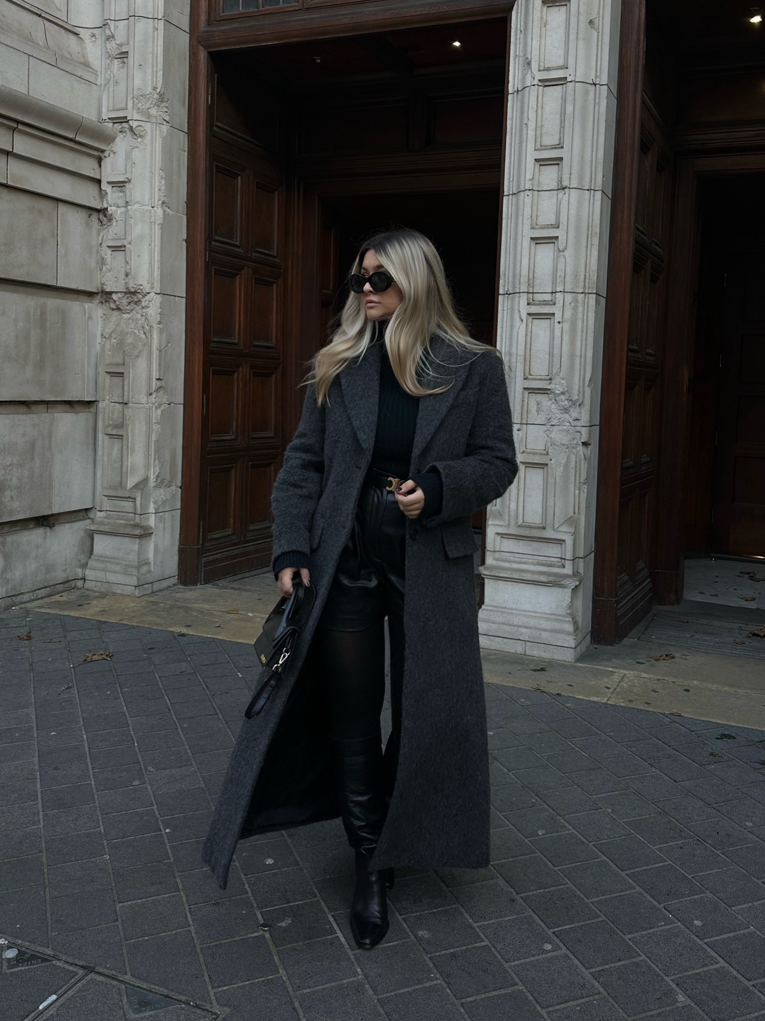 City girl 

Dark grey Long wool coat 
Knee high boots
Leather shorts
80 denier tights
Crossbody bag 
Celine sunnies 
