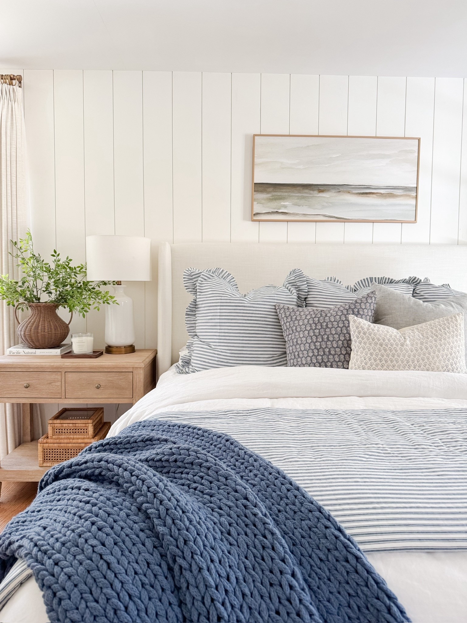 A look you’re loving! 🤍 A cozy and welcoming coastal bedroom scene. This bedding has the prettiest striped pattern—and it’s such a great price point! It comes in several color options and washes well. Our Tilly bed and our nightstand are also on sale!! 

#LTKSaleAlert #LTKHome