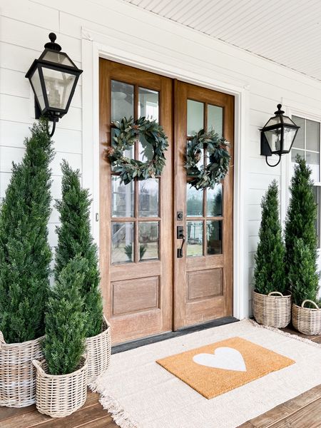 Valentine’s Day front porch and door decor Winter Front Porch! Love these gorgeous cedar trees! I have the 3’ 5’ and 6’ and the quality is so good! They’ve been outside for almost two years! Valentine’s Day doormat heart Faux artificial and silk indoor outdoor trees plants and flowers double layered jute rug and doormat eucalyptus berry wreaths rattan resin baskets front porch and door decor home accents spring front doors evergreen trees outdoor wall sconce lantern light fixtures

#LTKSeasonal #LTKstyletip #LTKhome