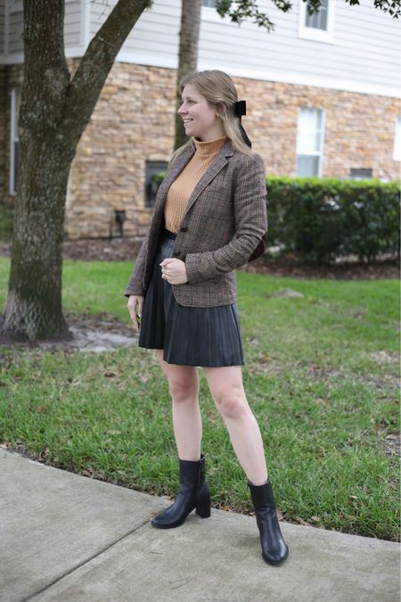 Fall outfit idea. Leather skirt, mock neck sweater, plaid tweed blazer, black boots under $50, and oversized hair bow  

#LTKunder50 #LTKSeasonal