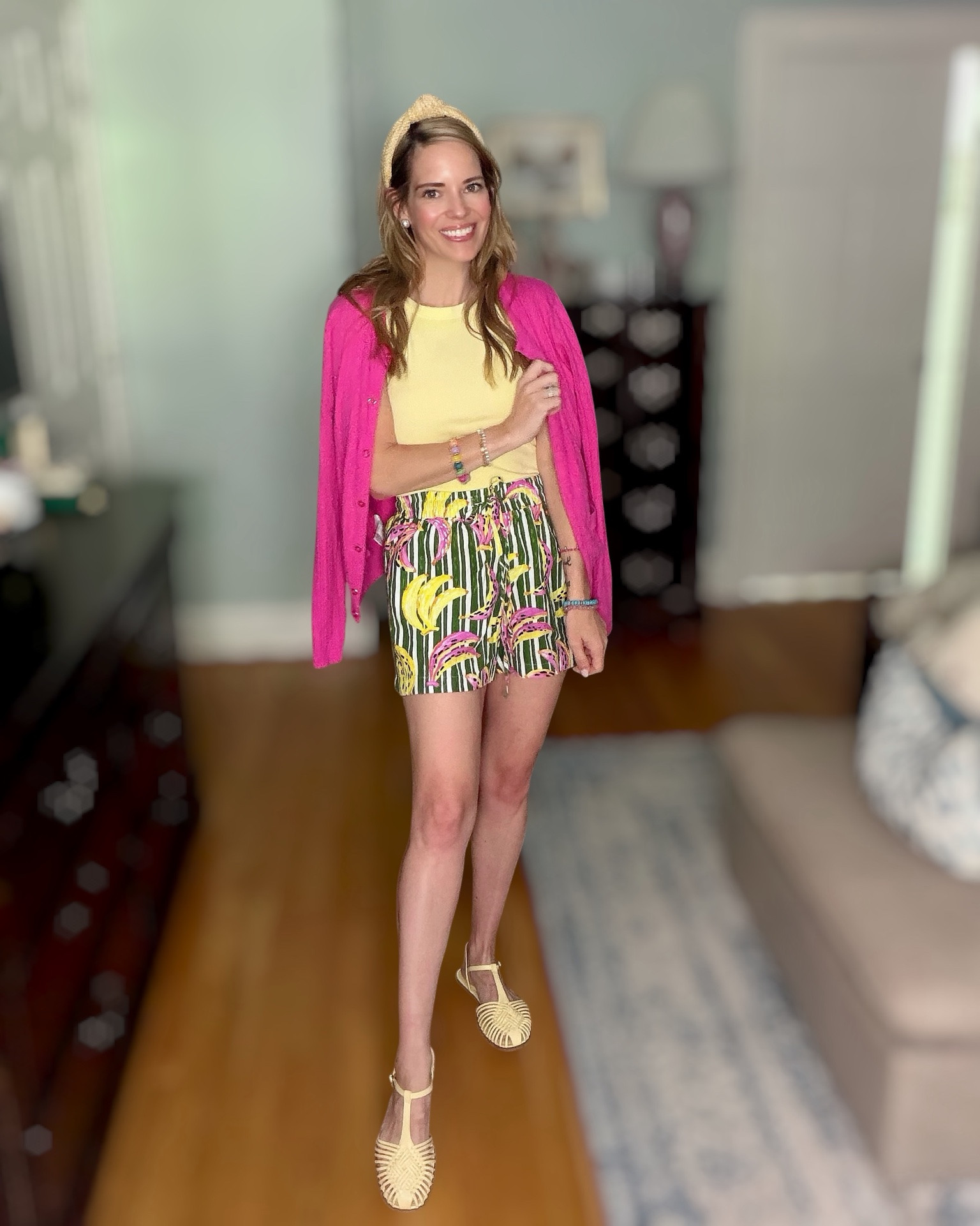 Bananas for Summer 🍌💖

This outfit is pure sunshine! I paired a soft yellow tank with the cutest banana print shorts for a fun, tropical-inspired look that’s perfect for warm summer days. ☀️🍌 The bright pink cardigan adds a bold pop of color, while the raffia headband, woven sandals, and colorful beaded bracelets bring everything together for a playful preppy vibe.

I love how the banana print makes a statement while still being easy to wear. Throw on the cardigan for chilly restaurants or keep it draped over your shoulders for that classic summer style. Whether you’re headed to brunch, vacation, a farmers market, or a casual summer gathering, this outfit is cheerful, comfortable, and full of personality. 💕🌴

If you’re looking to add a little fun to your wardrobe, printed shorts are such an easy way to brighten up everyday outfits while keeping things effortlessly chic. ✨

Banana print shorts, tropical summer outfit, colorful preppy style, pink cardigan outfit, yellow tank outfit, vacation outfit inspiration, resort wear, playful summer fashion, raffia headband, woven sandals, colorful accessories, women over 40 fashion, casual summer style, bright summer outfit. 🍌💖☀️🌴✨

#LTKPetite #LTKootd #LTKSeasonal