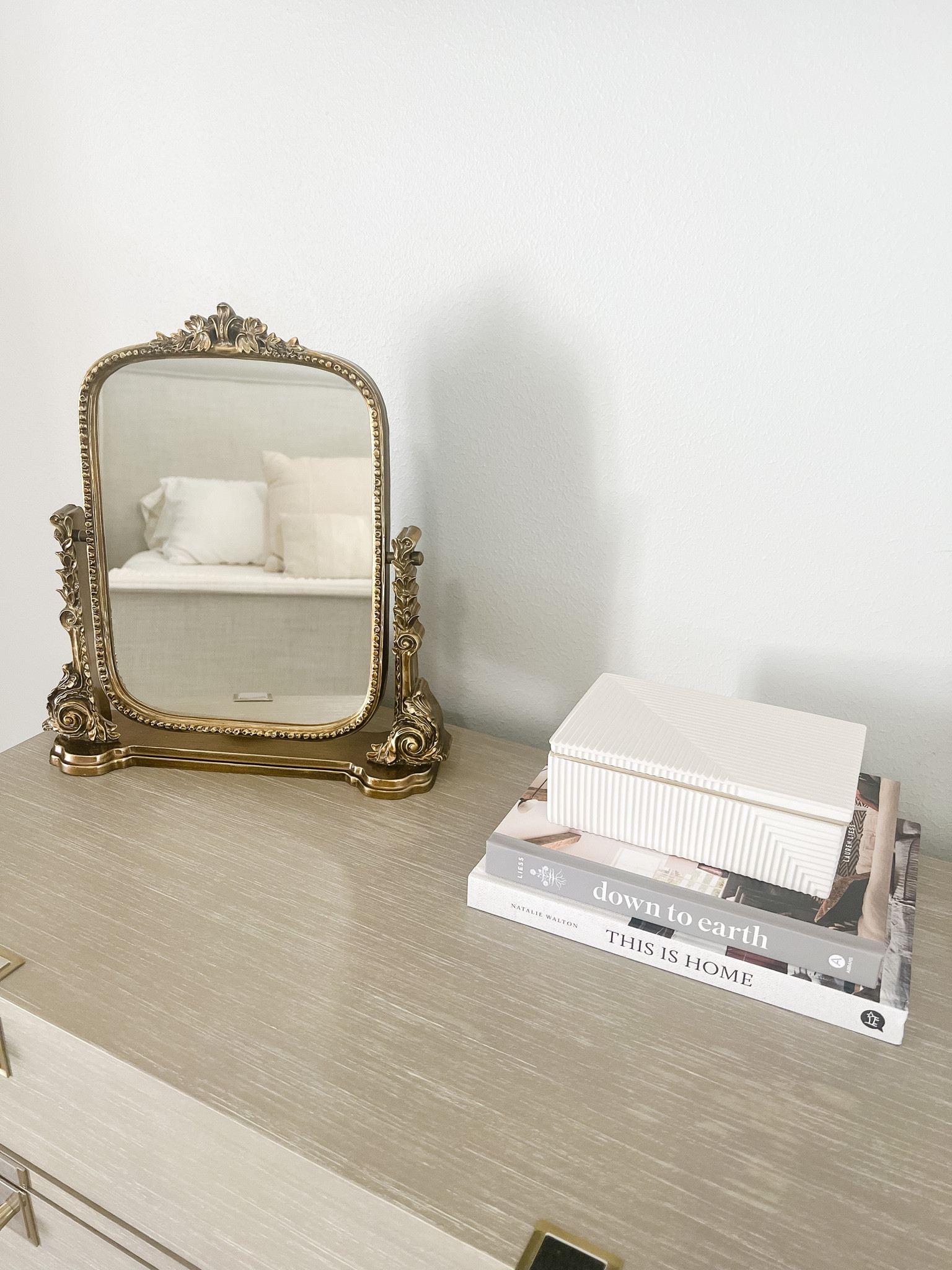 Bedroom dresser decor | Dresser styling | Gold vanity mirror | Anthropologie mirror | Fluted box | Neutral books

#LTKstyletip #LTKhome #LTKFind