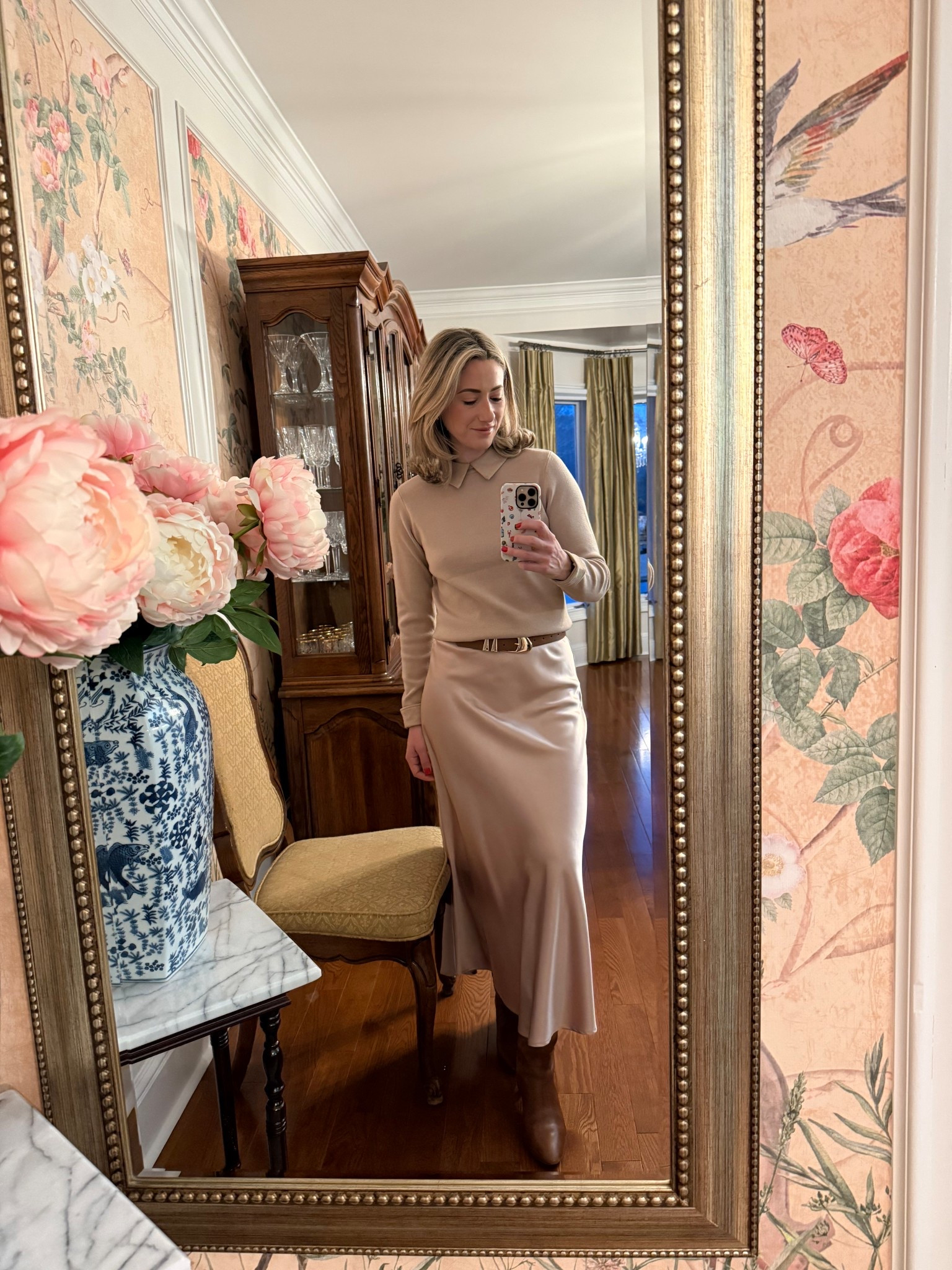 Neutral layers done the classic way 🤍 A cozy collard sweater, styled with a silky flowy skirt, brown leather belt and boots for an effortlessly elegant winter outfit. This is my go-to formula for looking put together while still feeling comfortable — soft tones, clean lines, and timeless pieces.

#LTKootd #LTKWorkwear #LTKgrwm