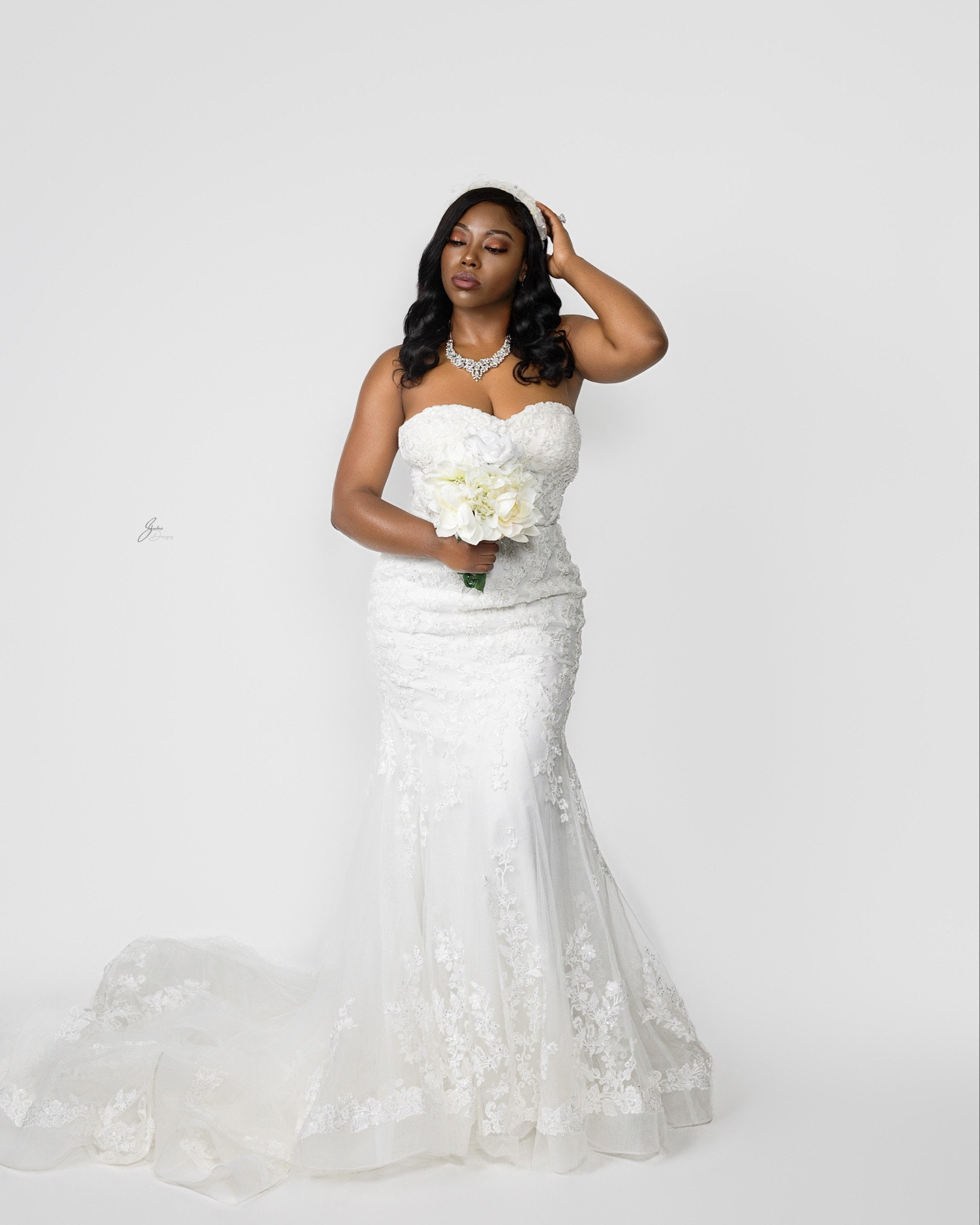 👰🏽‍♀️💍Full glam for a full-circle moment ✨🤍  👗This look was all about that say yes to the dress energy—and this is THE dress !🤍 This tulle and beaded lace mermaid gown from @davidsbridal has me feeling like I’m saying “I do” all over again!  I kept the glam soft and romantic to complement it:  💆🏽‍♀️Soft curls for a classic, effortless feel, topped with stacked bridal headbands for that extra touch of elegance  💄Soft glam makeup to enhance, not overpower  💅🏾Nude press-on nails with shimmer tips for a subtle sparkle  💎 Rhinestone necklace and mixed rhinestone + pearl earrings to tie it all together ✨  👡 Pearl design shoes to add value to the entire look   Every detail came together so beautifully, but let’s be real… the dress stole the show 🤩  Hair, Makeup, & Wardrobe Styling by yours truly   📸 @shadow_designz   #DavidsBridalPartner  #DavidsBridalStyleSquad  #BridalGlam  #SayYesToTheDress  #MermaidWeddingDress  

#LTKWedding