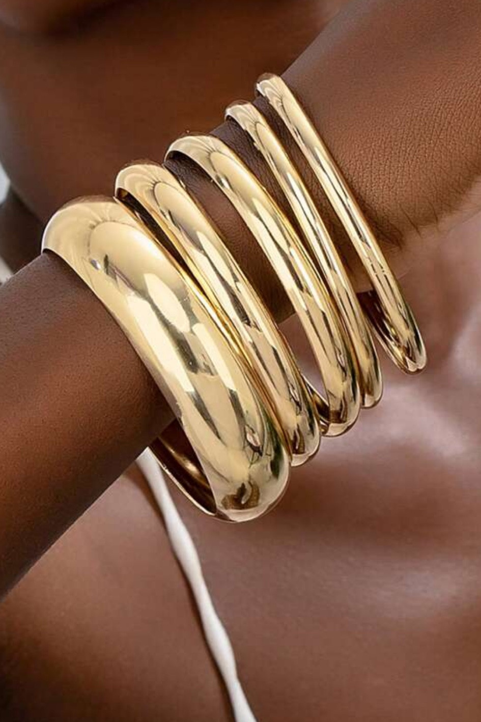 Gold bangles 

#LTKpartywear #LTKstyletip