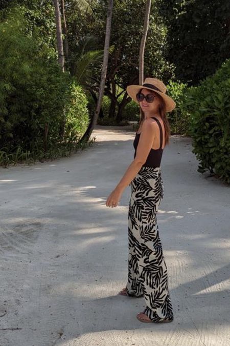 Linen patterned trousers, beach hat, black sunglasses, black swimsuit top, summer ootd, beach holiday outfit

#LTKstyletip #LTKeurope #LTKSeasonal