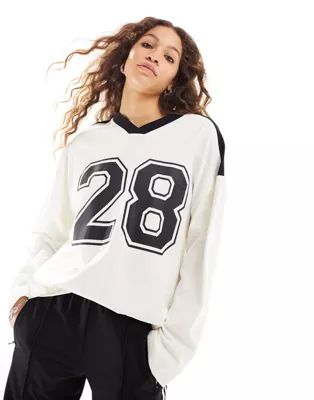 ASOS DESIGN long sleeve football tee with number 28 graphic and v neck in ivory | ASOS (Global)