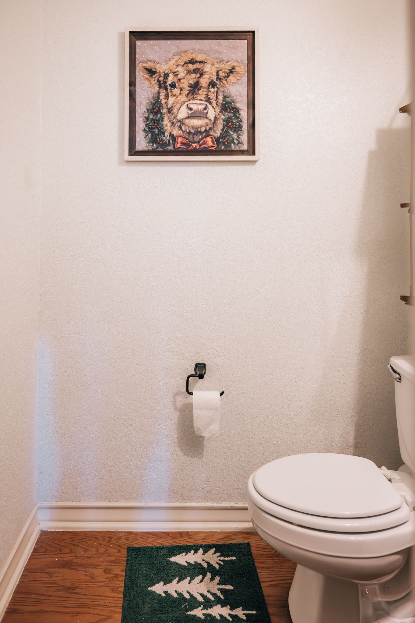 Even the powder room gets festive! 🎄 I upgraded the toilet paper holder for a sleek, modern touch and added this adorable holiday cow art and cozy rug for charm. Small updates make a big difference! Tap the link in bio to shop my holiday picks. #HolidayDecor #BathroomUpgrades #LTKHome

#LTKSaleAlert #LTKHome #LTKFindsUnder50