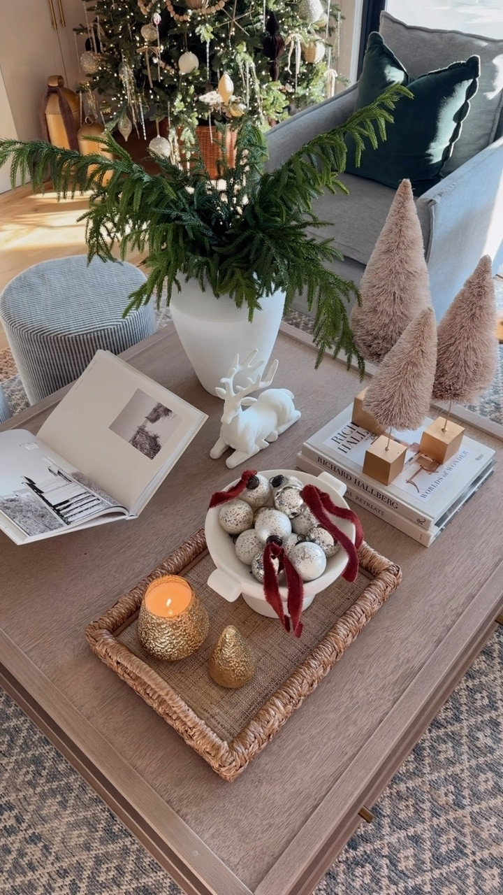 christmas coffee table styling 🦌 | this years christmas coffee table recipe: vase full of greenery, bottle brush trees on a stack of books for added height, tray with a yummy candle that also doubles as decor + a bowl full of ornaments as filler, my fave coffee table book (@saltwatercollection) & this gorgeous flocked deer(@hobbylobby) for added interest ✨ 

this may be my favorite styling yet! 🧑🏼‍🎄
#coffeetable #coffeetabledecor #tistheseason #christmasdecor #neutralchristmas #christmasmood #christmasdecorations #hobbylobby 

#LTKHome #LTKSeasonal #LTKHoliday
