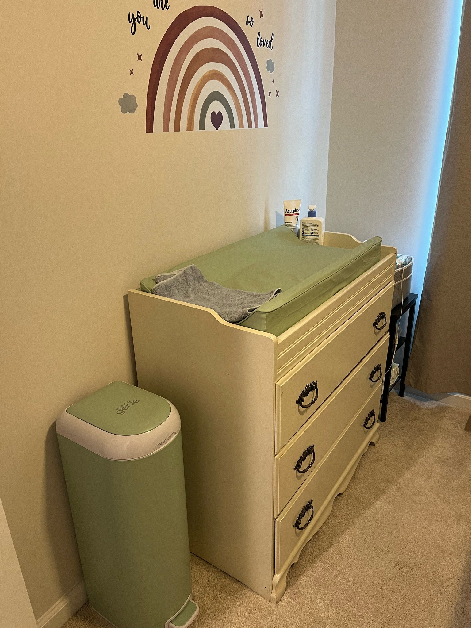 The nursery is our primary toddler care spot. All of the larger diapers, wipes, and booster pads are stored here. (We opted NOT to keep most newborn diapering items in this room, so we wouldn’t need to disturb the toddler at night.) I love this waterproof changing pad for easy clean up, and we have another diaper genie in this room, as well. And the wall decal serves as a great distractor for toddlers during a diaper change!

The dresser was actually gifted to me by my grandma and is over 40 years old. It’s such a sweet memory of my own childhood. We’ve designated one drawer for toddler clothes, one for newborn clothes, and one for extra blankets, swaddles, and burp cloths.

#NurseryNeeds

#LTKmomlife #LTKHome #LTKBaby