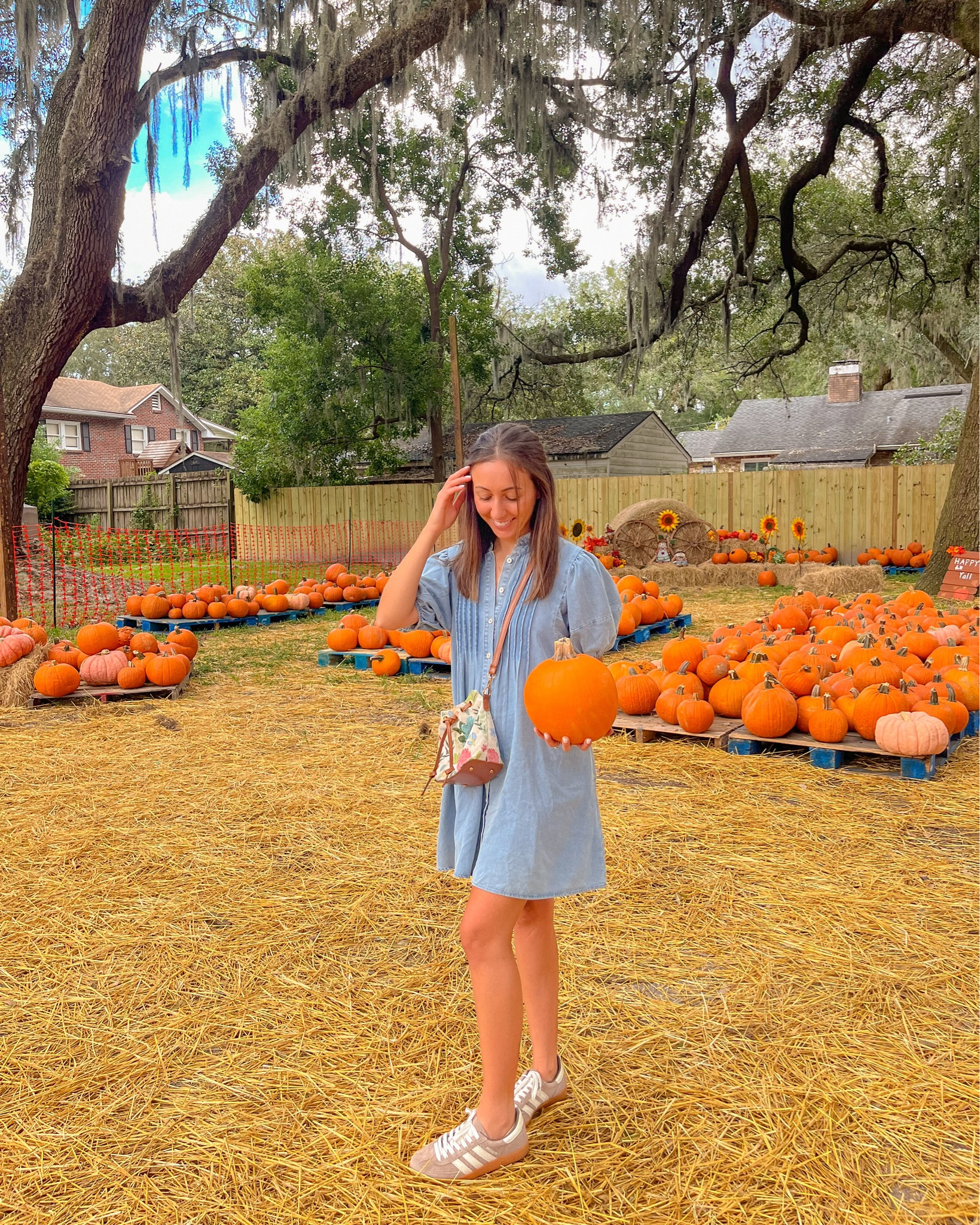 fall pumpkin patch outfit idea; denim dress, brown adidass