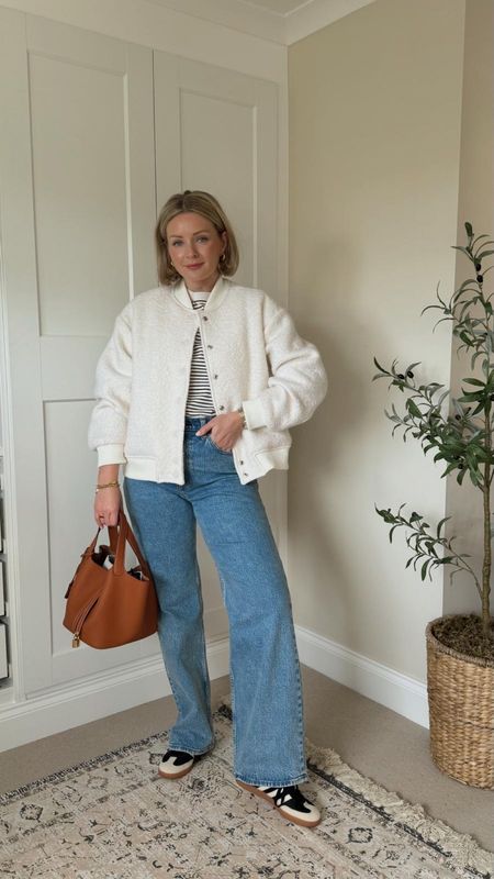 Ways to wear the Abercrombie 90s relaxed jeans. Cos striped t shirt, white wool look bomber jacket, adidas samba black and white trainers, beauty pie lip oil gloss, Monica vinader gold chunky hoop earrings, brown bucket bag. 

#LTKSeasonal #LTKeurope #LTKstyletip
