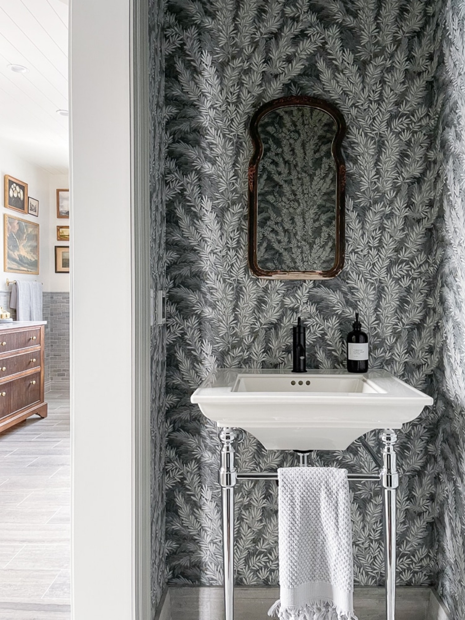 There's a pretty chrome pedestal under the powder room sink.

Pedestal sink, wallpaper, bathroomm

#LTKfamily #LTKhome #LTKstyletip