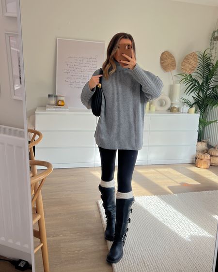 Oversized grey ribbed roll neck jumper styled with leggings and biker boots 