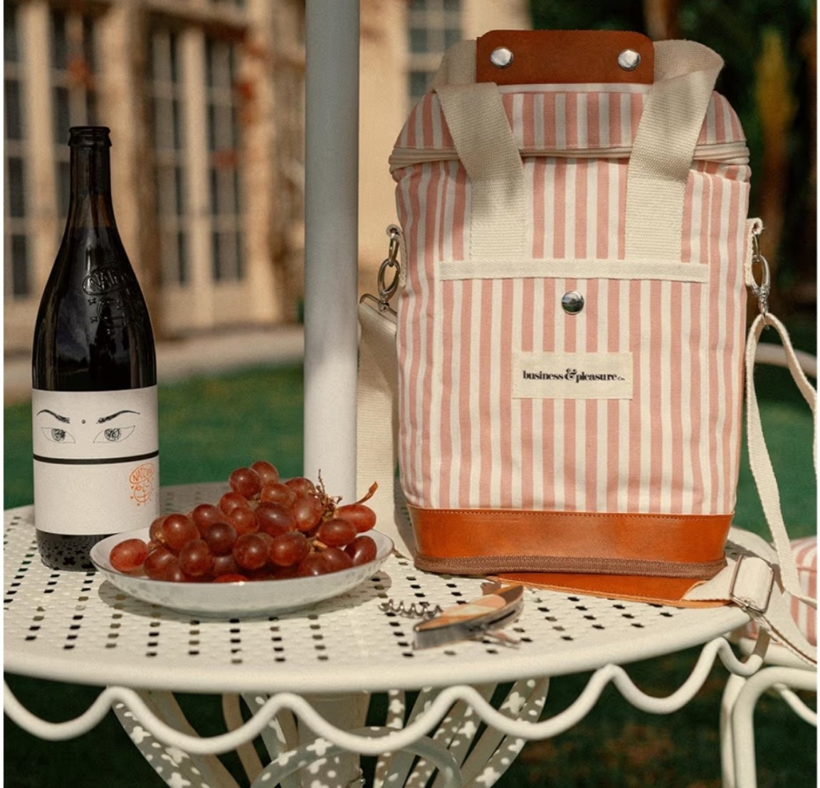 The cutest wine tote I've seen all season. ☀️ The pink stripe design gives major coastal picnic and country club summer vibes while keeping your favorite bottle perfectly chilled for beach days, boat days, picnics, outdoor concerts, girls' weekends, and sunset gatherings. Functional, beautiful, and effortlessly elevated, it's one of those little luxuries that makes every summer outing feel a bit more special. 

Bring this along and you'll be the friend everyone wants to picnic with. 🌸

#LTKTravel #LTKfoodie #LTKSwim
