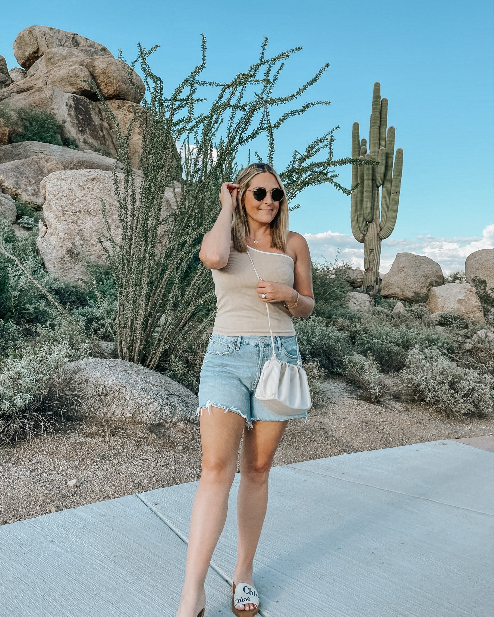 This one shoulder tank from Petal & Pup was perfect for the desert! Love the neutral color and simplicity of it!  Also wearing my favorite denim shorts of the season!

#LTKitbag #LTKstyletip