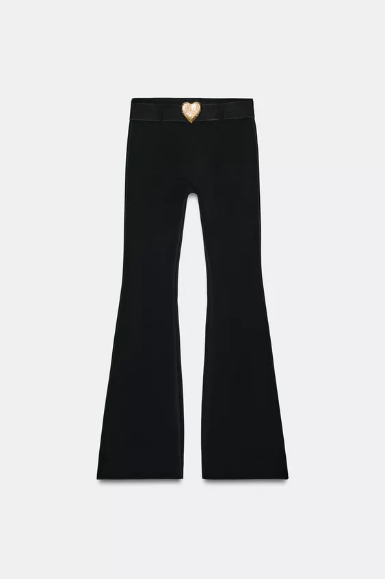 Pants made of elastic fabric. High waist with elastic waistband. Belt detail with heart-shaped me... | Zara US