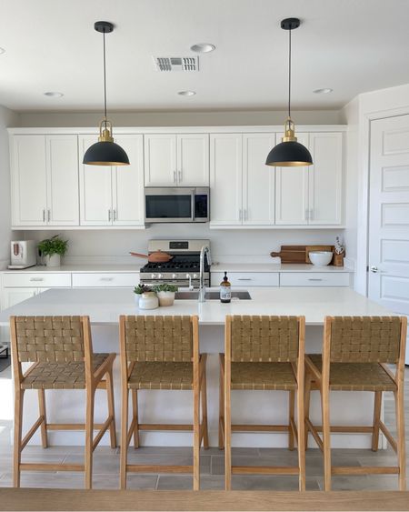 I’ve been looking for the perfect pendant lights to help warm up my bright white kitchen in my new house. The ones I wanted were one $800 each but I found this pair for under $100 on Amazon! They are much nicer than I expected for the price! Love these neutral barstools too!  

#LTKhome #LTKunder100 #LTKstyletip