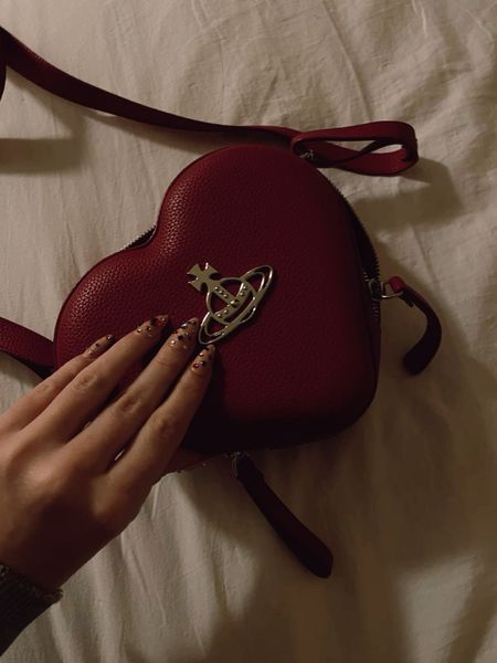 Vivienne Westwood bag. Red heart shape, Louise mini bag. Faux leather, Orb logo plaque at the front. Wardrobe staple. Timeless. Gift guide idea for her. Farfetch, designer. Luxury, elegant, clean aesthetic, chic look, feminine fashion, trendy look, date night out. 

#LTKeurope #LTKparties #LTKitbag