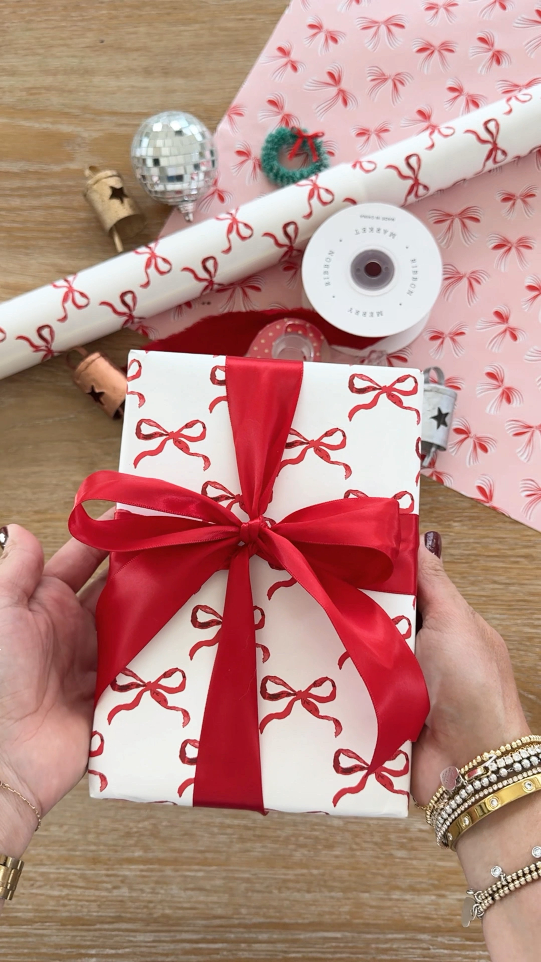 How to tie a bow on a gift box so the back is flat! Linking this cute bow print wrapping paper plus a few more faves! 

#LTKSeasonal #LTKHoliday #LTKWatchNow