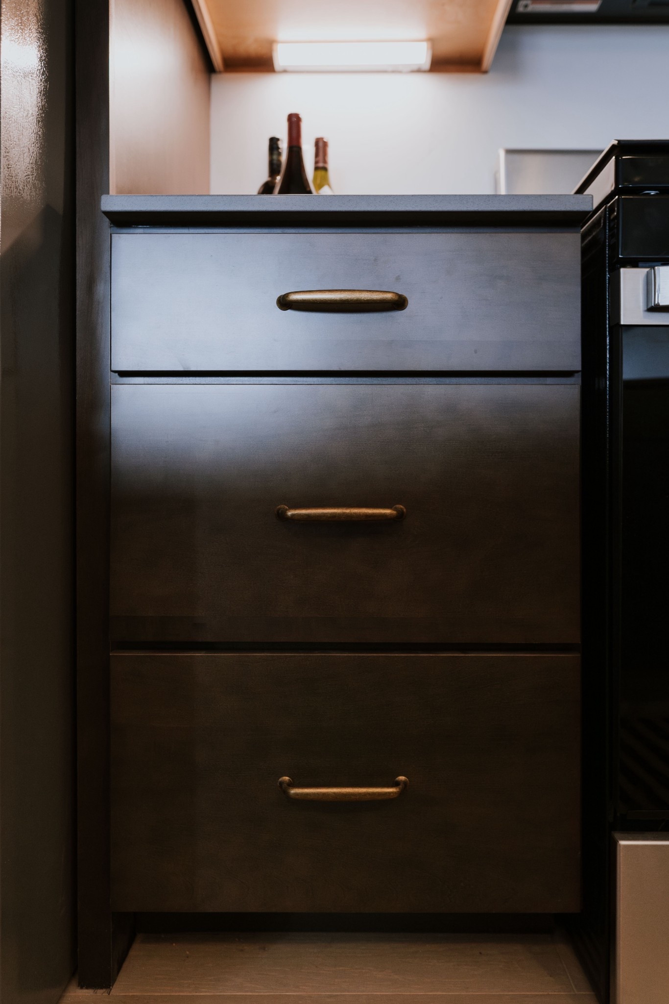 Dark wood cabinetry meets warm brass accents for a timeless, elevated kitchen detail. A perfect blend of function and style 🌟

#LTKStyleTip #LTKHome