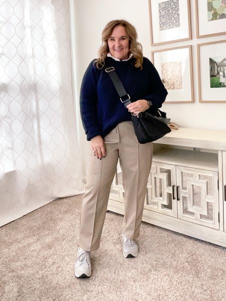 Faux leather khakis are on sale! I’m in a large. Definitely go with your smaller size. I’m in a large. 

100% cotton fisherman sweater. Excellent sustainably sourced quality sweater. I went with an XL for an oversized look. 

Favorite drifit white blouse for layering underneath. Size L. 

And tts sneakers. Love them. 

Straps on purse are removable. 
#competition 

#LTKworkwear #LTKunder100 #LTKFind