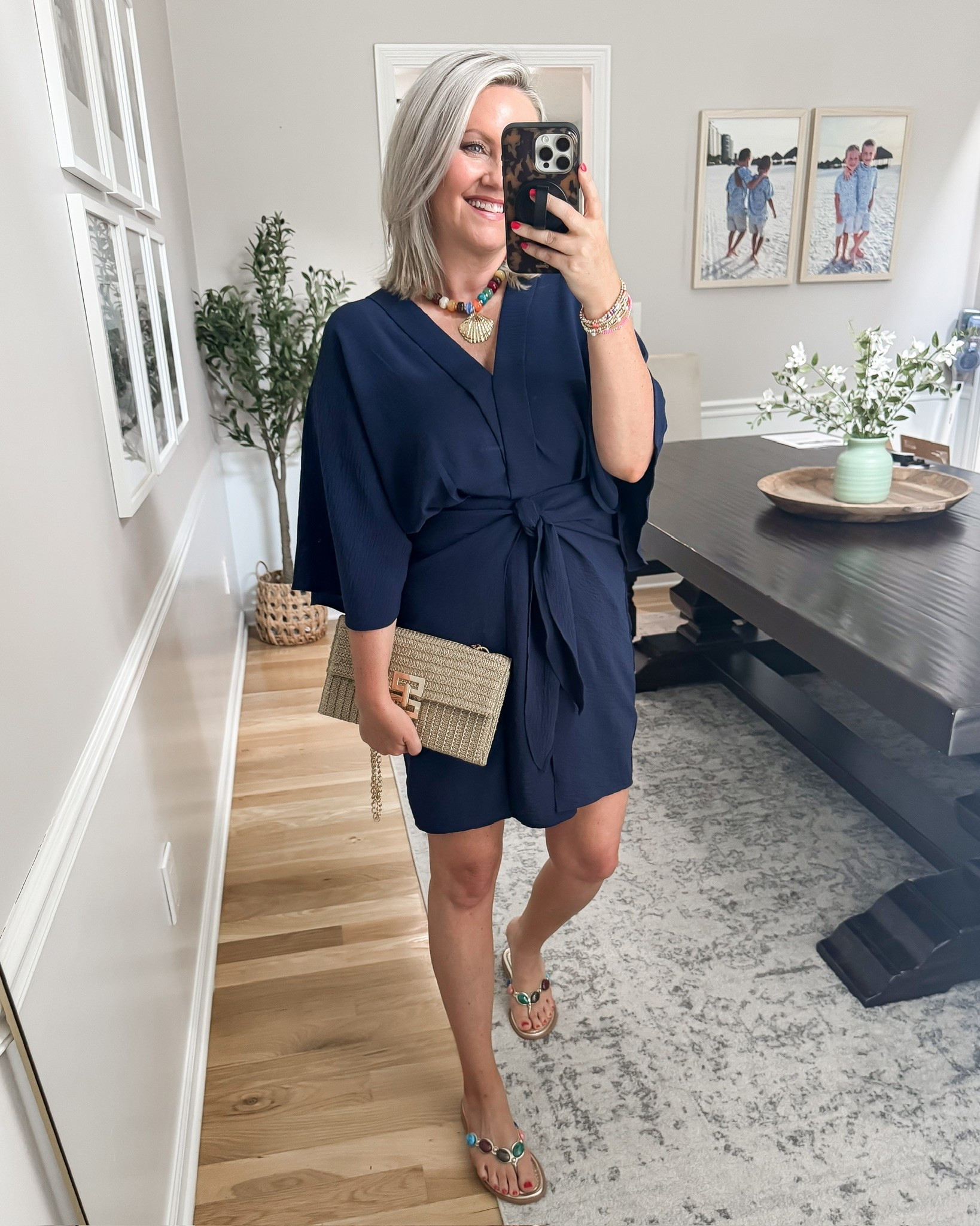 This navy wrap dress is what I’d wear when dinner plans call for something nice, but the weather still demands comfort. The lightweight fabric, relaxed sleeves, and adjustable tie create shape without feeling clingy, while the colorful accessories keep the navy from feeling too serious.

navy wrap dress, summer dinner outfit, lightweight dress, tie waist dress, vacation style, date night outfit, comfortable dress, colorful accessories, polished summer look, lovelylifestyling

#LTKootd #LTKOver40 #LTKTravel