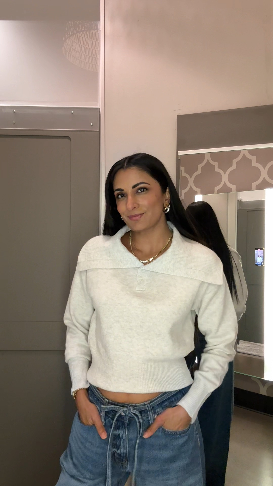 Size XS in the sweater 
Size 6 in the jeans 