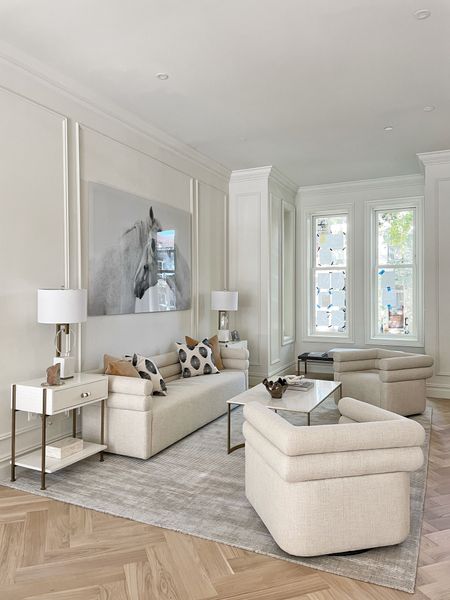 White on white luxury living room for Summer! This room is full of white home decor and furniture for everyday use along with statement art on the wall and desks for storage! 🤩 #luxurylivingroom #luxuryhome #luxuryhomedecor

#LTKFind #LTKhome #LTKfamily