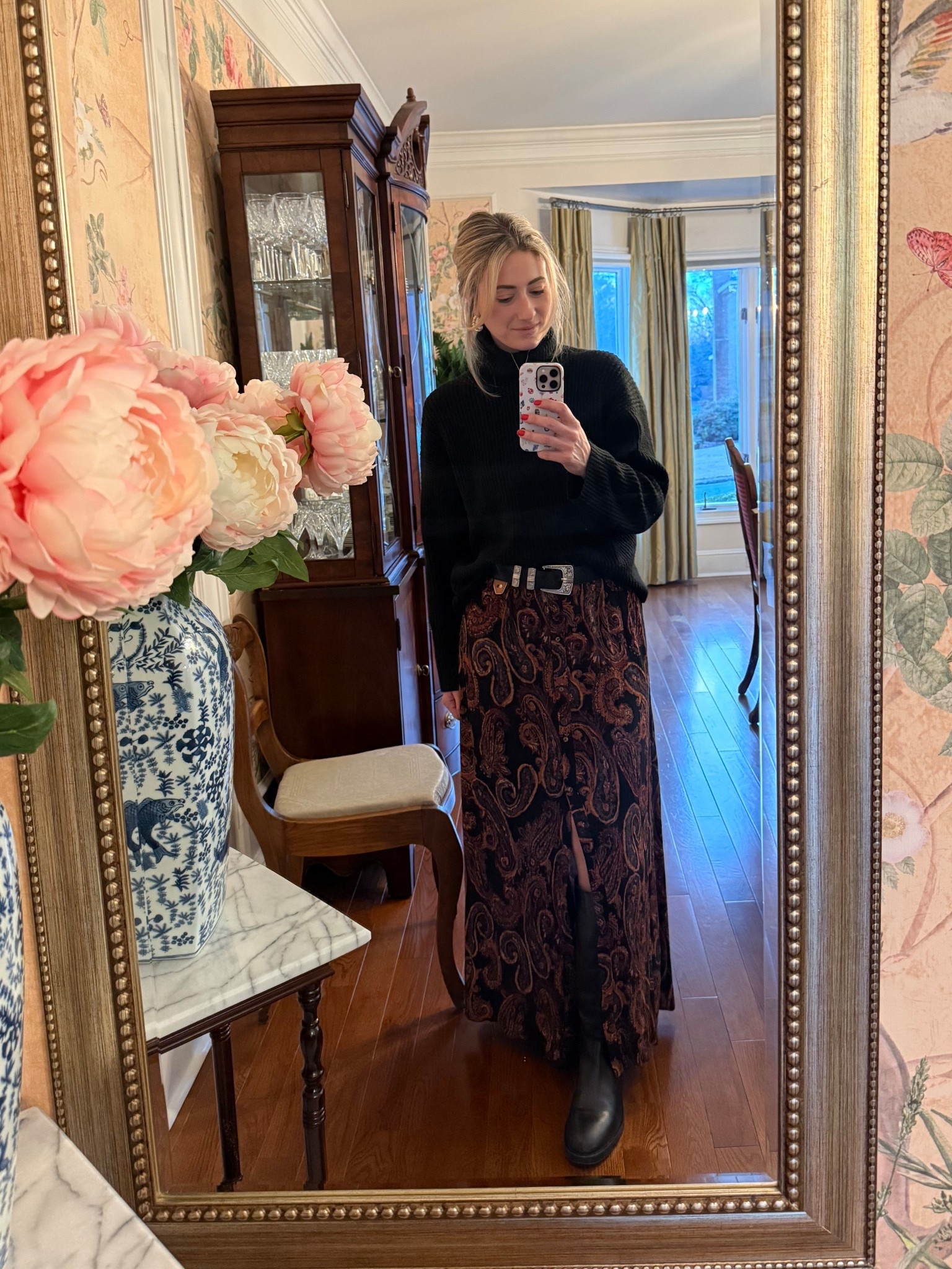 Classic with a moody twist 🖤 A black ribbed turtleneck paired with a black and brown paisley skirt, finished with black boots and a silver-buckle belt. This is one of my favorite ways to mix feminine patterns with clean, tailored staples for an effortlessly put-together look.

#LTKgrwm #LTKootd #LTKWorkwear