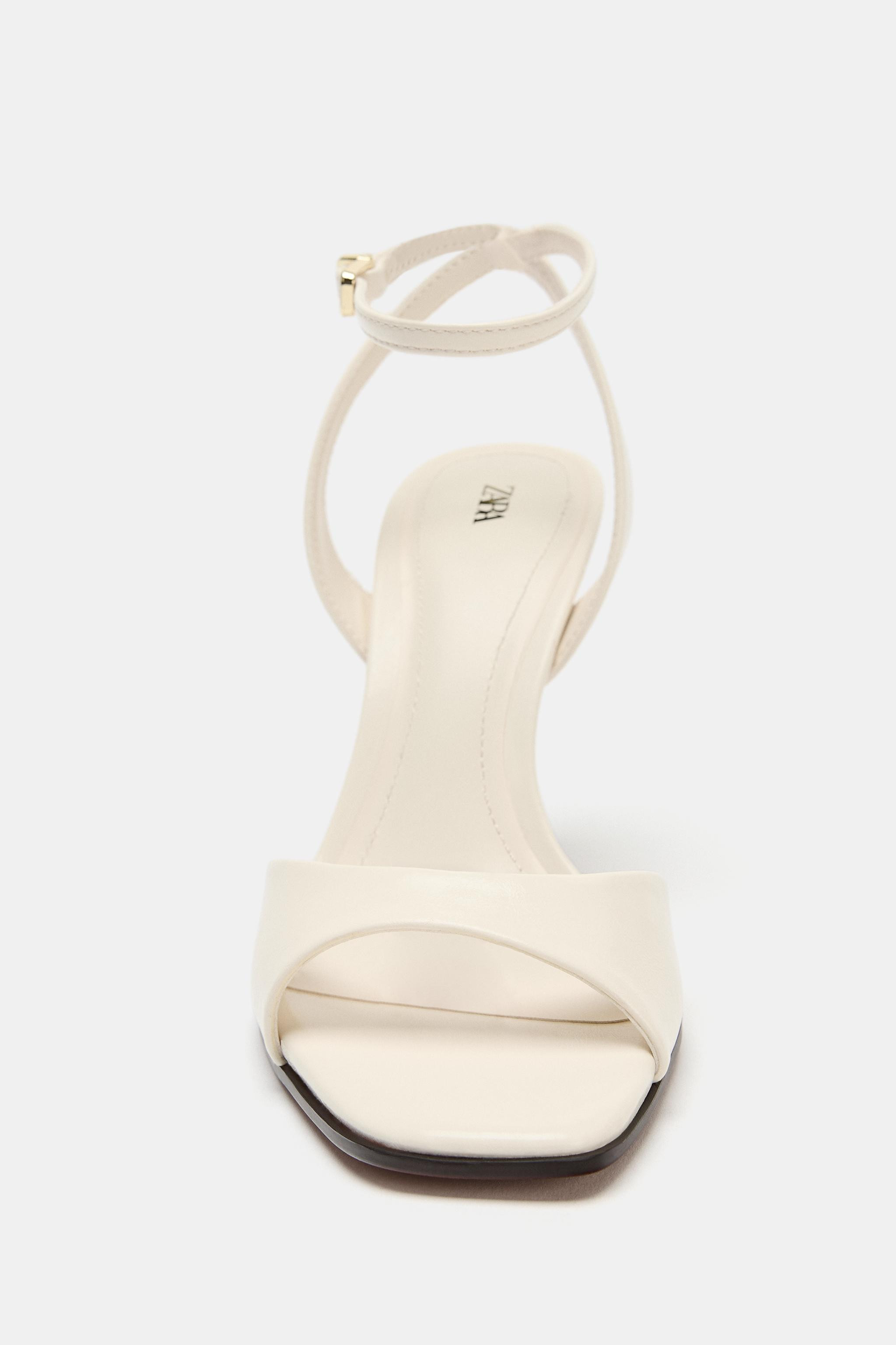 Model height: 181 cmHeeled sandals. Front strap. Ankle strap with metallic buckle fastening. High... | Zara UK