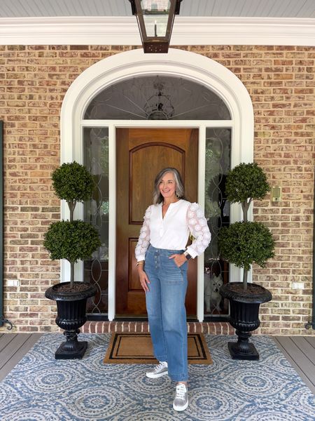 Chico’s jeans are truly the best! These are so stretchy with pull on styling. The blouse with the unique sleeves are so pretty! Dress it up or down with silver sneakers for a fun look! #chicos #lovechicos #widelegdenim #over50style #over40style #weekendlook #frontporchdecor #denim #jeans 

#LTKstyletip #LTKshoecrush #LTKFind