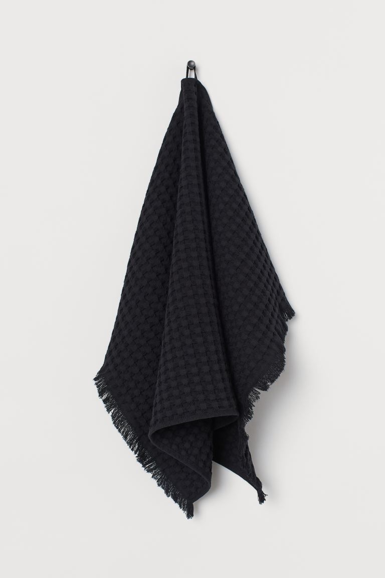 Hand towel in waffled cotton fabric. Fringe at short sides and hanger loop on one long side. | H&M (US + CA)