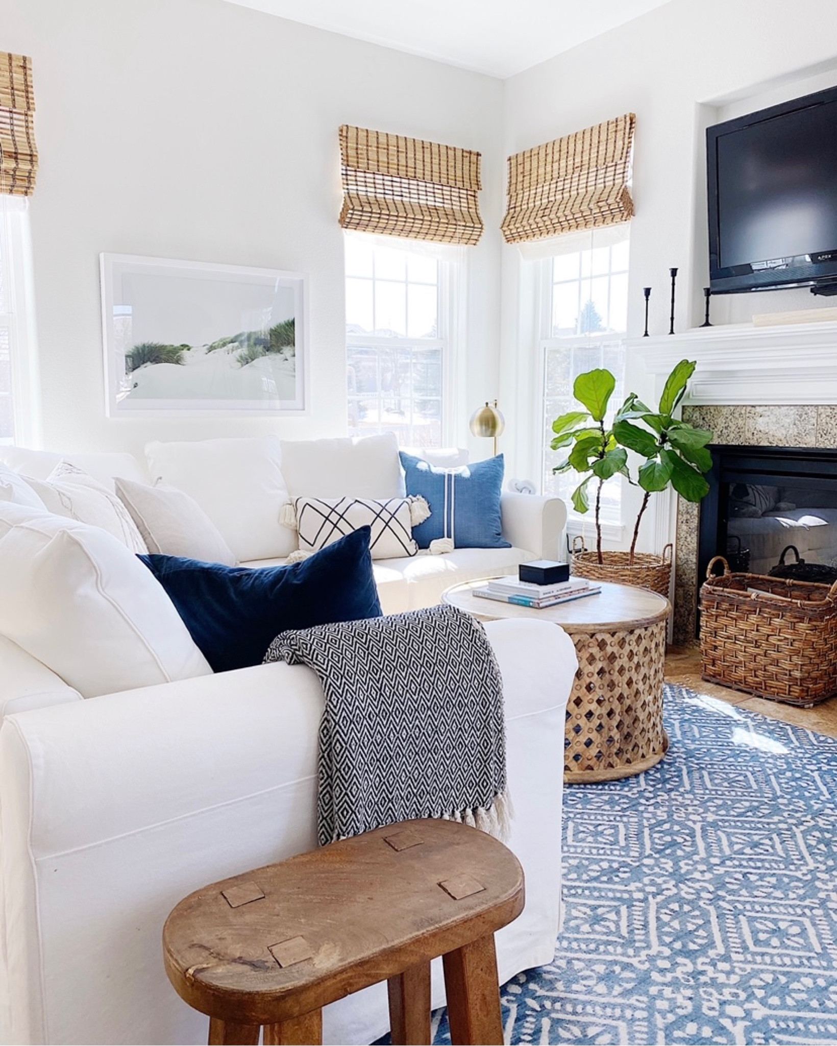 Living room decor, living room furniture, modern coastal decor, round wood coffee table, sectional, white slipcovered sofa, area rug, pillows, home decor, summer decor 



#LTKunder100 #LTKhome #LTKsalealert