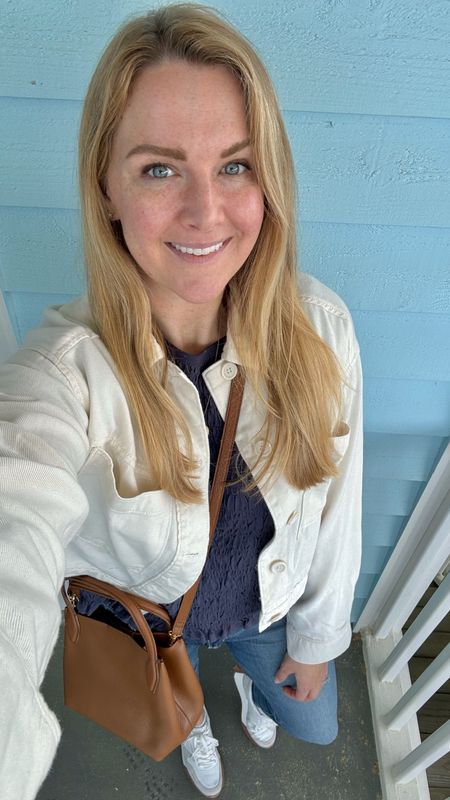 Casual spring outfit of the day 

Lightweight white canvas utility jacket - love how broken in and comfy this is! 

Smocked shortsleeved tee underneath in navy

Favorite high waisted blue jeans

Wearing my normal size in all the clothess

Brown convertible crossbody handbag 

White sneakers 

#LTKfindsunder50 #LTKSeasonal #LTKstyletip