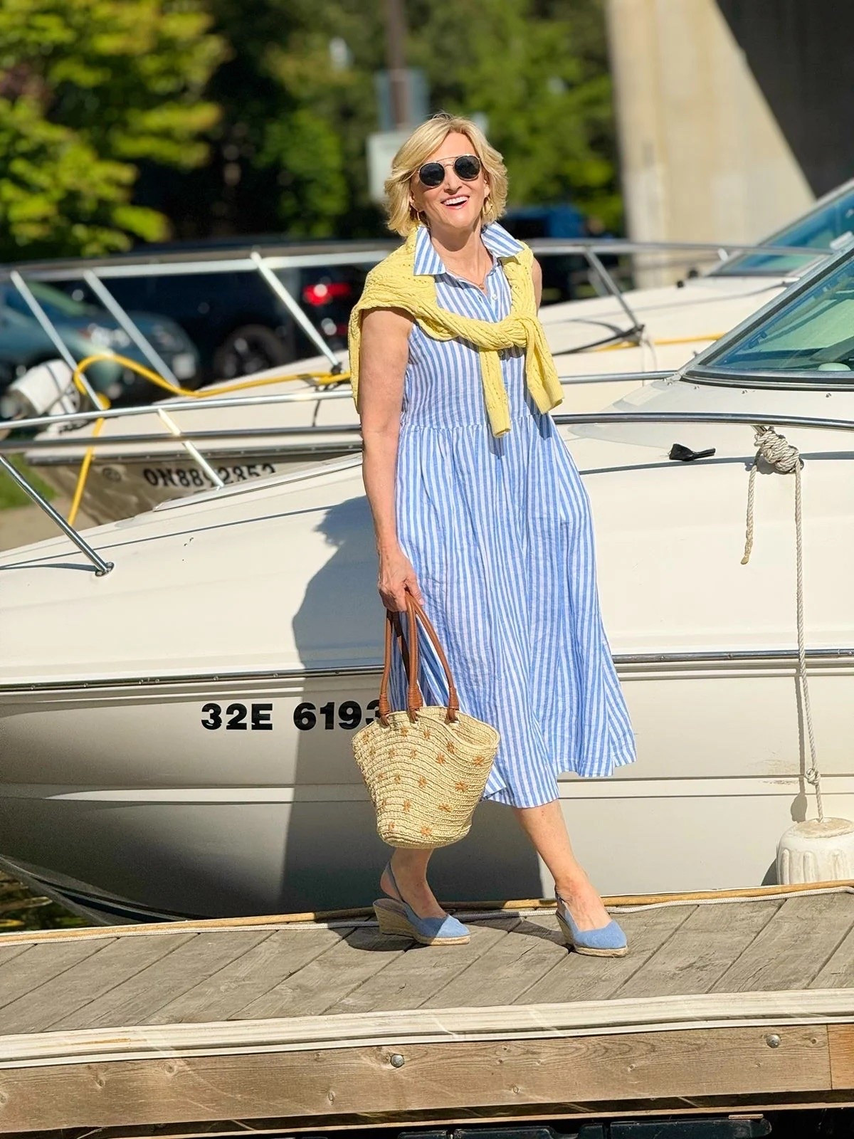 This outfit just feels like summer ☀️💙💛 A blue and white striped dress paired with a sunny yellow open-knit sweater casually tied over the shoulders, a woven tote and denim espadrilles.

I love how the little pops of yellow and texture make a simple striped dress feel so much more interesting. Easy, relaxed and perfect for those days when you want your outfit to do the talking! ✨

#LTKootd #LTKSeasonal #LTKOver40