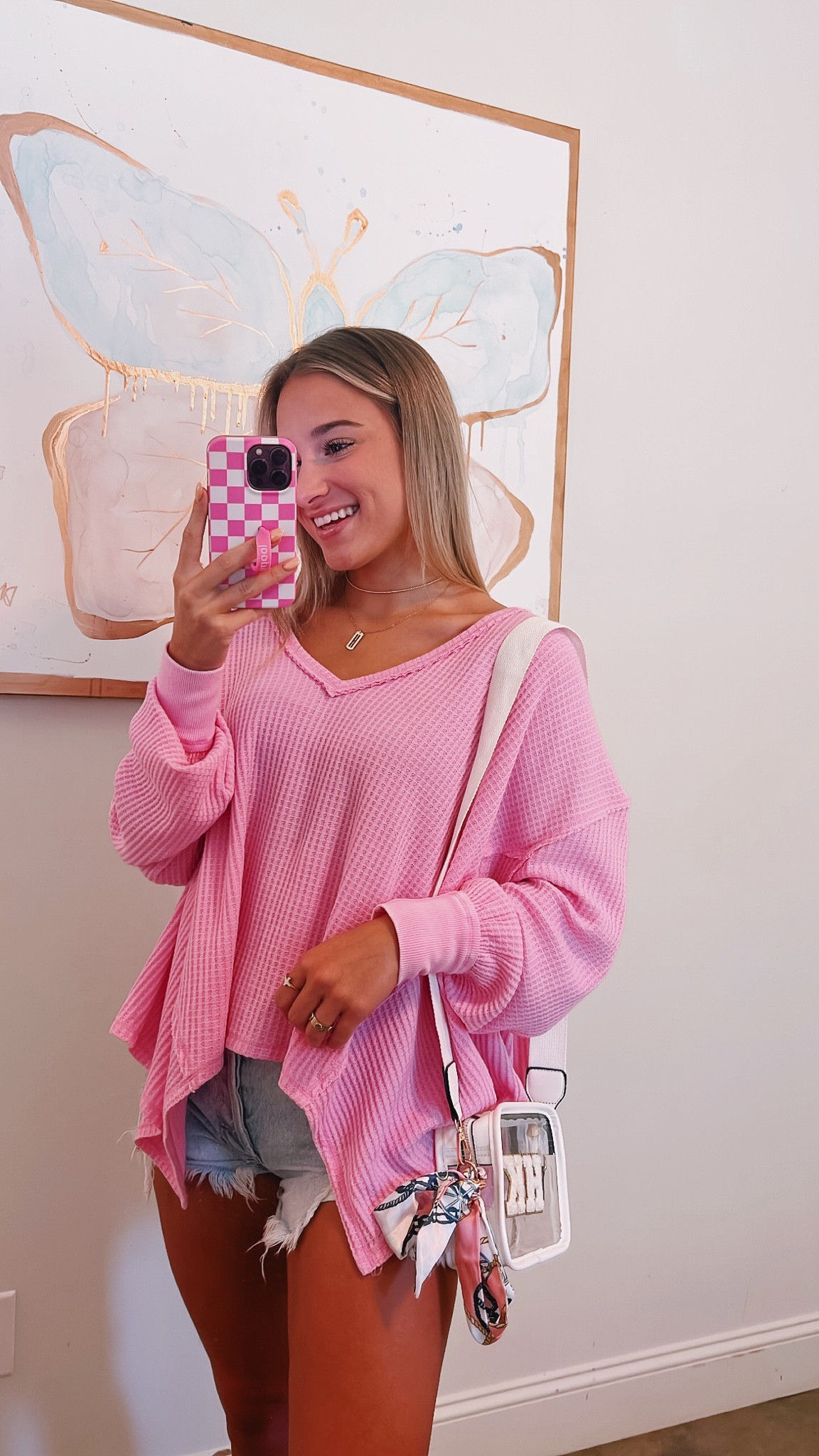 obsessed with this top🩷✨so cute with jean shorts, athletic shorts, leggings, or jeans! runs big—i sized down to an XS  

#LTKSeasonal #LTKfindsunder100 #LTKstyletip