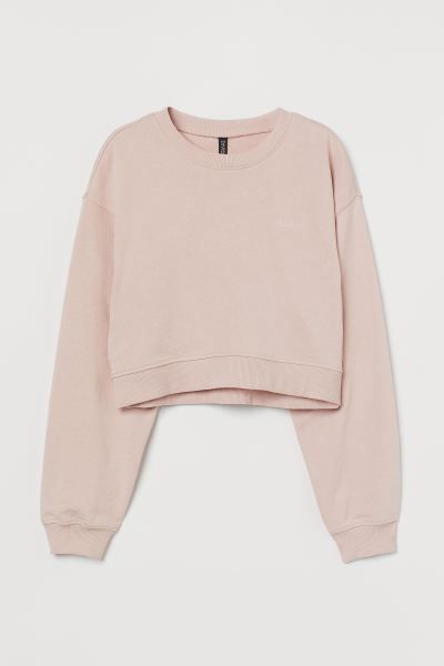 Short, soft sweatshirt with an embroidered detail at top. Crew neck, dropped shoulders, and long ... | H&M (US + CA)