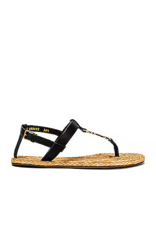 Saint Laurent Cassandra Flat Sandals in Nero | FWRD | FWRD 