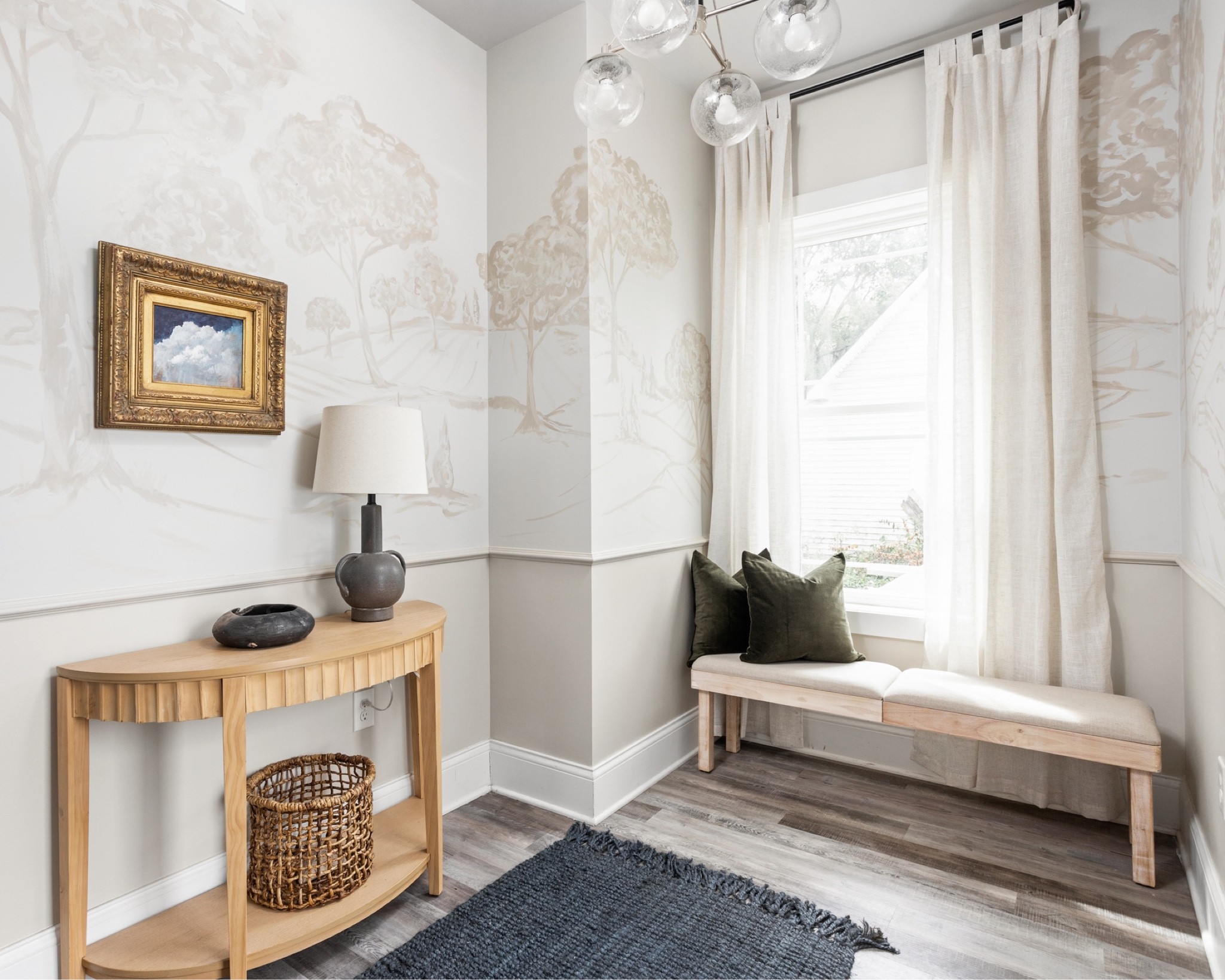 The custom mural and chair rail make the entry feel purposefully designed .

#LTKhome