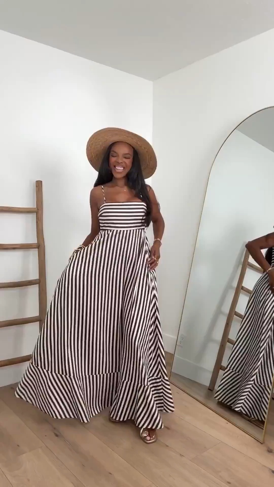 Hi Babes!

Okay this striped maxi dress is giving luxury resort energy and I am obsessed. The chocolate brown and ivory stripes, dramatic flowy silhouette, and oversized sun hat create the kind of effortless outfit that looks straight out of a high-end vacation campaign.

If you're petite and curvy, this dress is a dream because the fitted bodice creates shape through the waist while the full skirt flows beautifully over the hips. The vertical stripes help elongate the body and make the entire look feel elegant and expensive.

Where to wear this:
• European vacations
• Resort getaways
• Beachside dinners
• Cruise vacations
• Summer brunches
• Winery weekends
• Special vacation photos

Undergarments: Nude strapless bra and seamless brief for the smoothest fit.

Everything is linked below.

xx Kira | IG: KirasFashionFinds

34D - 27 - 40 • Size Small or 4

Follow me on Instagram and YouTube @kirasfashionfinds