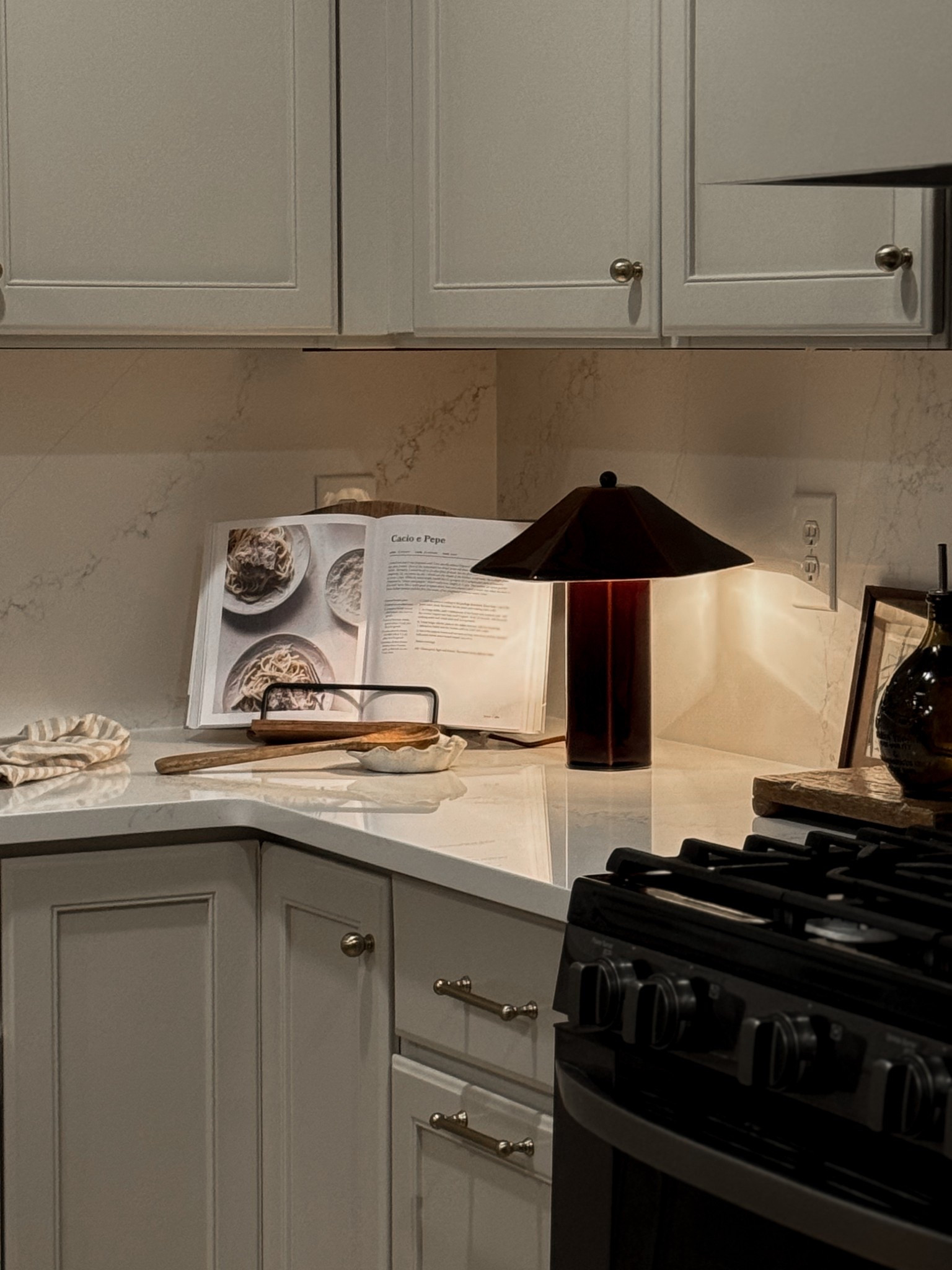 Kitchen counter corner decor, simple kitchen styling, cookbook holder, kitchen lamp

Cabinets are Accessible Beige by Sherwin Williams 

#LTKfoodie #LTKHome