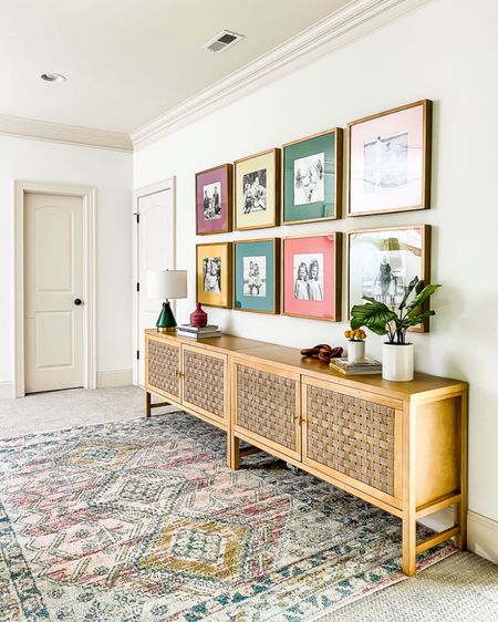 Here’s a little throwback to what our upstairs hallway looked like before we added board and batten and the girls’ “apartment doors”! It blows my mind how different this space looks like now! 🤯  #consoletable #arearug #colorfulrug #entryway #hallway #hallwaydecor #tablelamp #target #homedecor 

#LTKhome