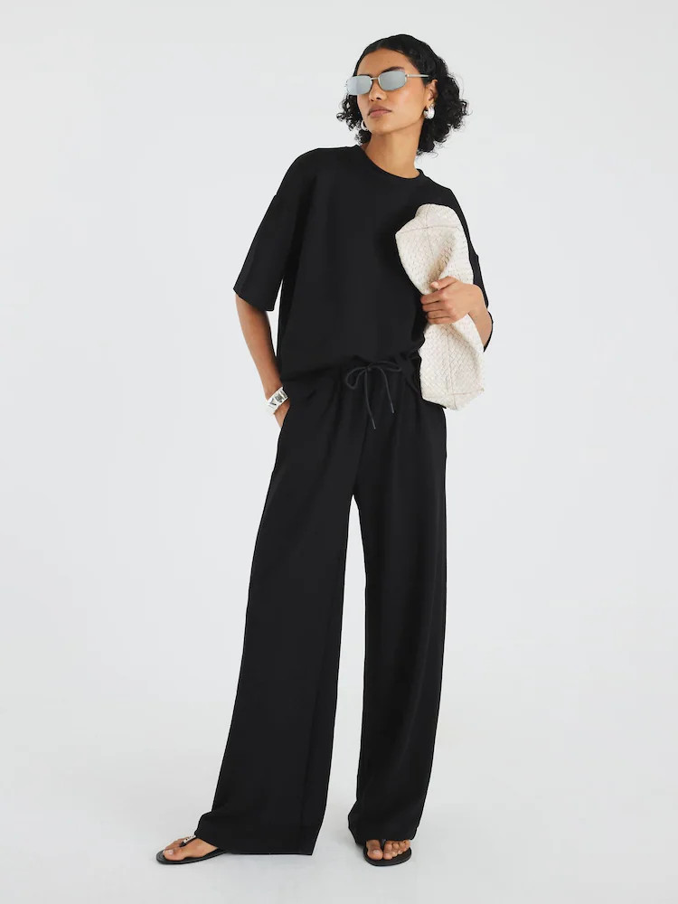 Buy River Island Black Premium Swash Wide Leg Joggers from Next Belgium | Next EU
