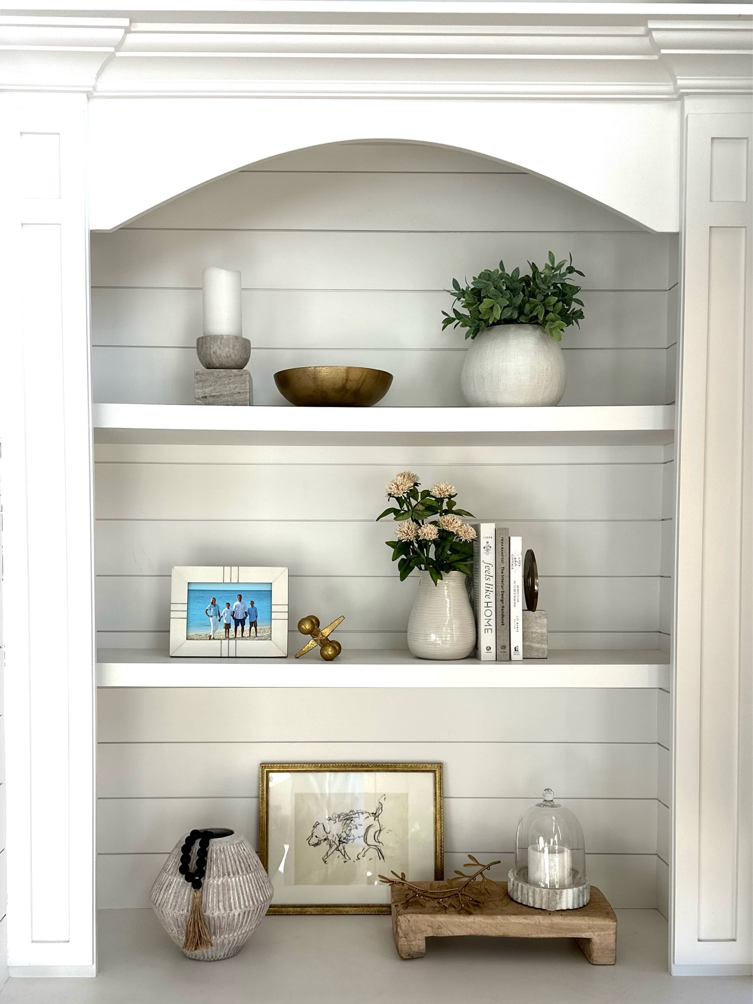 Shelfie Decor 
Marble objects, gold accents, frames, faux greenery and stems, vases, bowls, coffee table books. Shelf styling. Shelf decor.

#LTKhome