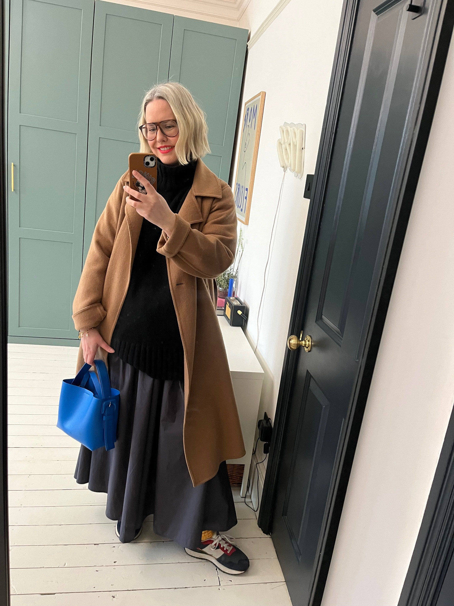 A-line poplin skort, maxi skirt, Oversized turtleneck jumper, Leather Crossbody Bag, Coat UNIQLO, Trainers

#LTKeurope #LTKstyletip #LTKSeasonal