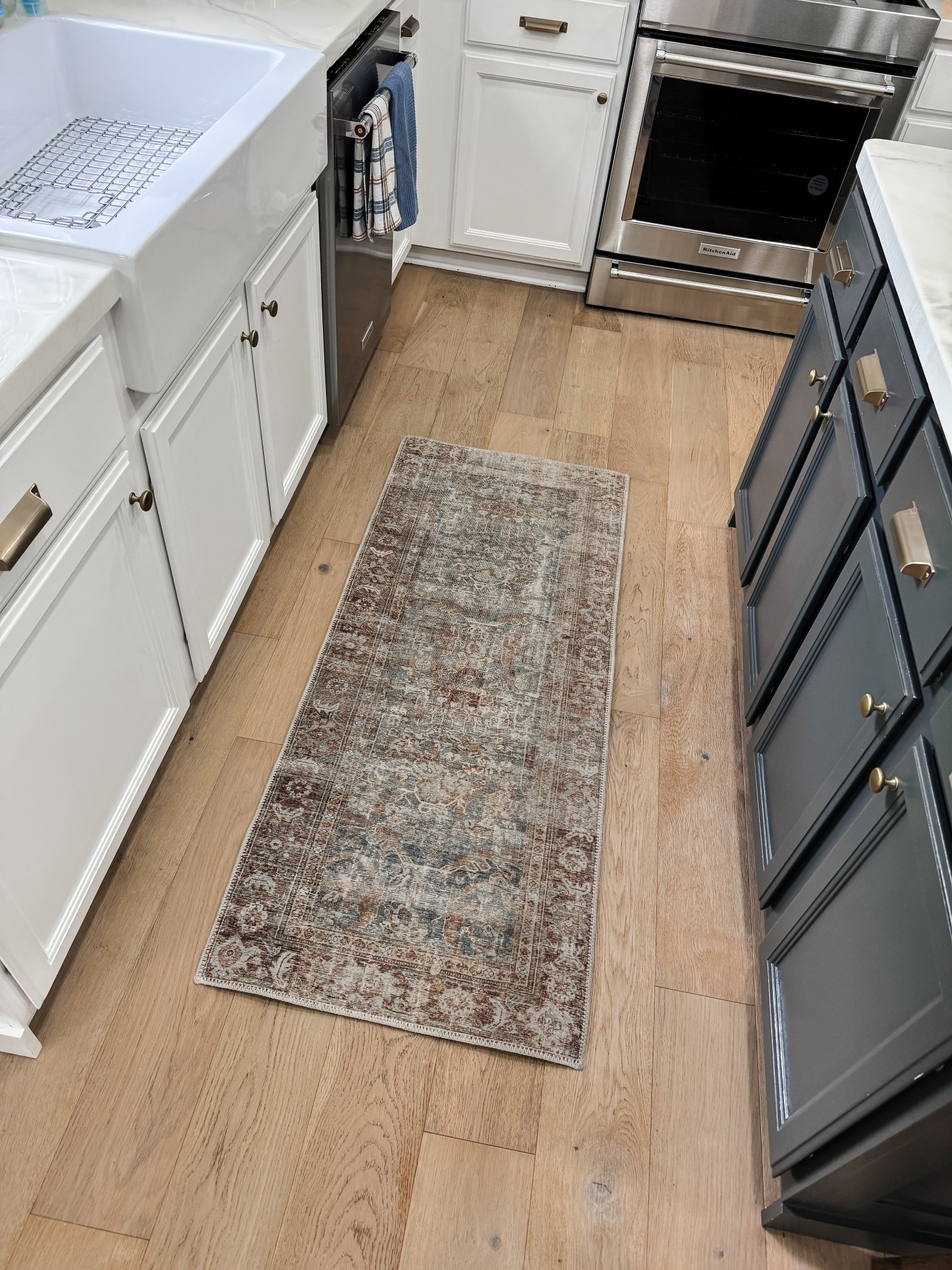My kitchen rug is 60% off right now!!! Such an amazing deal and such a pretty muted rug!!! 

Beautiful neutral runner for your kitchen!

Kitchen rug // neutral green and brown kitchen // muted rug // farmhouse style // French country decor // Chris loves Julia rug // wayfair finds //kitchen decorating // washable rugs 

#LTKSaleAlert #LTKHome #LTKFindsUnder50